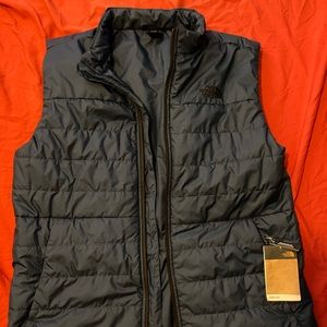 The North Face navy blue puff vest